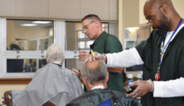 Men having their hair cut in a barber shop