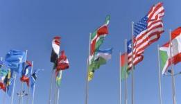 Flags from multiple countries blowing in the wind